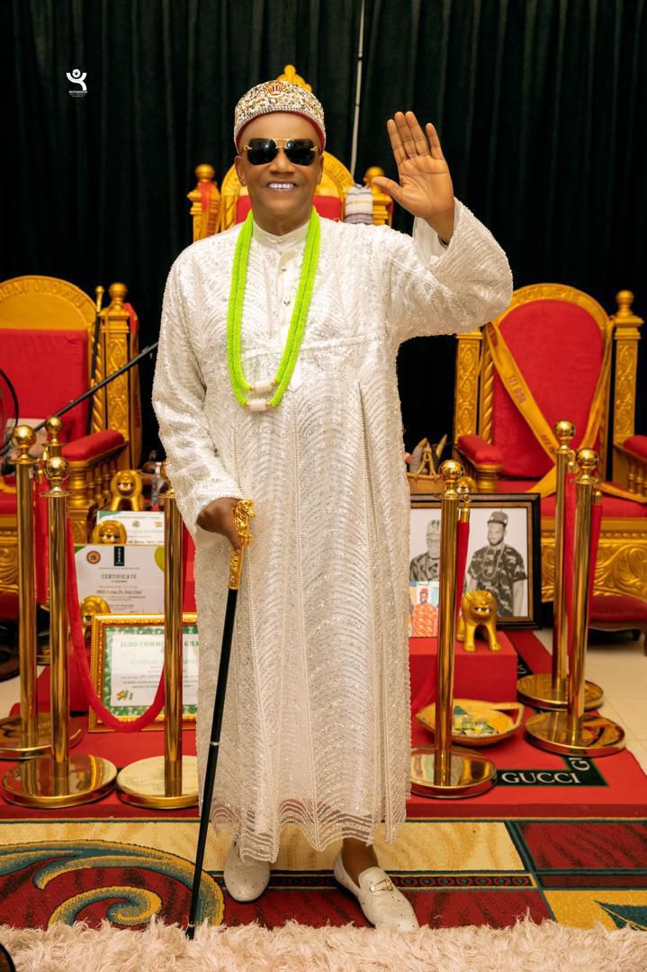 Eze Dr. Evang. Tony Ulasi waving in royal white regalia